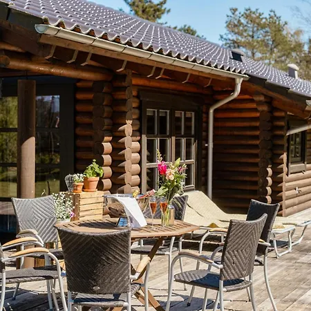 Authentic Log House Amid Evergreens In Vendsyssel *