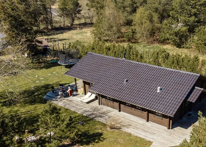 Authentic Log House Amid Evergreens In Vendsyssel *